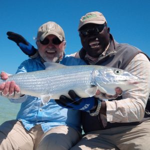 Big Charlie Andros Bonefish Guide with Client and Bonefish